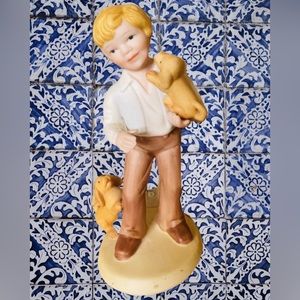 Avon Porcelain “Best Friends” Figurine~Boy with Two Puppies. Dated 1981